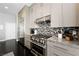 Contemporary kitchen equipped with stainless steel appliances, granite countertops, and designer backsplash at 2325 Prometheus Ct, Henderson, NV 89074