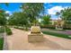 Scenic view of lush landscaping, a pedestrian walkway, and planter detail enhance the property's curb appeal at 2325 Prometheus Ct, Henderson, NV 89074
