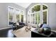 Bright and airy living room with lots of natural light, featuring large windows and comfortable seating at 2325 Prometheus Ct, Henderson, NV 89074