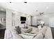 Modern living room with a contemporary fireplace, recessed lighting, and a comfortable sectional sofa at 2325 Prometheus Ct, Henderson, NV 89074