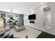 Contemporary living room featuring a sleek fireplace, modern decor, and access to outdoor living space at 2325 Prometheus Ct, Henderson, NV 89074