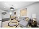 Inviting living room with a comfortable sectional sofa, stylish decor, and ample natural light at 2325 Prometheus Ct, Henderson, NV 89074