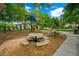Community playground with a slide, picnic tables, and shade, perfect for Gathering fun and relaxation at 2325 Prometheus Ct, Henderson, NV 89074