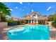 Stunning backyard with a sparkling pool, spa, and ample space for outdoor seating at 2325 Prometheus Ct, Henderson, NV 89074