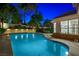 Beautifully designed pool area features sparkling water, manicured landscaping, and an inviting poolside ambiance at 2325 Prometheus Ct, Henderson, NV 89074