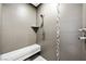 Modern shower featuring a built-in bench, hand-held shower, and a sleek tile design at 2325 Prometheus Ct, Henderson, NV 89074