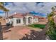 Spacious backyard featuring minimal desert landscaping and rock features with a small patch of green grass at 2588 Mizzoni Cir, Henderson, NV 89052