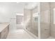 Bathroom showcasing a glass shower with mosaic floor, complemented by a modern dual sink vanity at 2588 Mizzoni Cir, Henderson, NV 89052