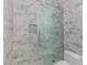 Sleek bathroom shower with marble tiling, glass door, and modern shower fixtures at 2588 Mizzoni Cir, Henderson, NV 89052