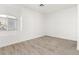 Bright bedroom features wood-look floors and a window for plenty of natural light at 2588 Mizzoni Cir, Henderson, NV 89052