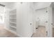 Bright hallway leading to the laundry room, featuring clean, modern design and built-in shelving at 2588 Mizzoni Cir, Henderson, NV 89052