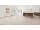 Open-concept living area with white walls, and views to the kitchen at 2588 Mizzoni Cir, Henderson, NV 89052
