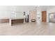 Spacious living area featuring a central kitchen island and cozy fireplace at 2588 Mizzoni Cir, Henderson, NV 89052