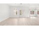 Well-lit open area with white walls and wood-look floors at 2588 Mizzoni Cir, Henderson, NV 89052