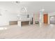 Bright open floorplan with modern lighting and stylish kitchen at 2588 Mizzoni Cir, Henderson, NV 89052