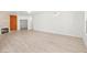Expansive living area showcasing a stone fireplace and light wood-look floors at 2588 Mizzoni Cir, Henderson, NV 89052