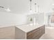 Open living space with a large island, perfect for entertaining and modern living at 2588 Mizzoni Cir, Henderson, NV 89052