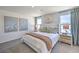 The spacious primary bedroom has an upholstered headboard and lots of natural light at 2641 Begonia Falls Ave # 88, North Las Vegas, NV 89081