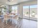 Charming dining area with a modern table, wicker chairs, and sliding glass doors to the backyard at 2641 Begonia Falls Ave # 88, North Las Vegas, NV 89081