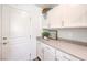 Functional laundry room with ample storage cabinets and a convenient countertop space at 2641 Begonia Falls Ave # 88, North Las Vegas, NV 89081