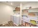 Convenient laundry room featuring a washer, dryer, and ample shelving for storage at 2641 Begonia Falls Ave # 88, North Las Vegas, NV 89081