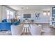 Stylish living room with a comfortable blue sofa, patterned chairs, and a chic coffee table at 2641 Begonia Falls Ave # 88, North Las Vegas, NV 89081
