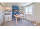 Bright home office featuring a wooden desk, built-in shelving, and a large window at 2641 Begonia Falls Ave # 88, North Las Vegas, NV 89081