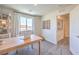 Well-lit office features a wooden desk with a view of the outdoors and custom shelving at 2641 Begonia Falls Ave # 88, North Las Vegas, NV 89081