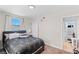 This bedroom features a large window, a modern bed frame, and a closet at 2712 Holmes St, North Las Vegas, NV 89030