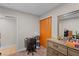 Bedroom featuring an open doorway, natural lighting, and a work area including a desk and chair at 2712 Holmes St, North Las Vegas, NV 89030