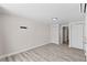 This bedroom provides wood-look flooring, neutral walls, and offers ample storage with its two closets at 2712 Holmes St, North Las Vegas, NV 89030