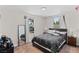Bright bedroom featuring natural light, a comfortable bed, and a full-length mirror at 2712 Holmes St, North Las Vegas, NV 89030