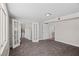 Bonus room featuring a large area for entertaining, carpeted floors, and natural light at 2712 Holmes St, North Las Vegas, NV 89030