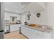 Spacious kitchen with white cabinetry, granite counters, and stainless steel appliances at 2712 Holmes St, North Las Vegas, NV 89030