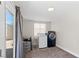 Functional laundry room features modern washer and dryer set, with natural light from the window at 2712 Holmes St, North Las Vegas, NV 89030