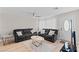 Comfortable living room with plush sofas, a ceiling fan, and natural light at 2712 Holmes St, North Las Vegas, NV 89030