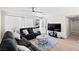 Cozy living room with neutral decor, plush sofas, and a view to the front door at 2712 Holmes St, North Las Vegas, NV 89030