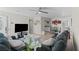Open-concept living space with modern furnishings, a TV, and a view to the dining area at 2712 Holmes St, North Las Vegas, NV 89030