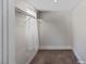 Walk-in closet featuring carpet flooring, a window, and a closet rod at 2712 Holmes St, North Las Vegas, NV 89030