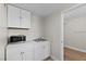 Convenient wet bar features a sink, white cabinets, and ample counter space at 2712 Holmes St, North Las Vegas, NV 89030
