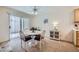 Cozy dining area featuring a round table, neutral carpet, and sliding door access to the patio at 2902 Aztec Lily Ln, Henderson, NV 89074
