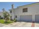 Two-story home with attached garage, featuring a stucco exterior and neat landscaping at 2902 Aztec Lily Ln, Henderson, NV 89074