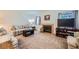 Comfortable living room with neutral tones, a cozy fireplace, and ample seating at 2902 Aztec Lily Ln, Henderson, NV 89074
