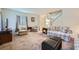 Spacious living room featuring neutral decor, plush seating, and staircase access at 2902 Aztec Lily Ln, Henderson, NV 89074