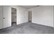 Spacious bedroom featuring carpet flooring and an open closet at 3150 Soft Breezes Dr # 2046, Las Vegas, NV 89128