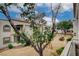 Picturesque view from the balcony highlighting the community's lush landscaping, mature trees and building exteriors at 3150 Soft Breezes Dr # 2046, Las Vegas, NV 89128