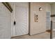 Condo front door featuring a secure screen door, numbered unit, and exterior lighting at 3150 Soft Breezes Dr # 2046, Las Vegas, NV 89128