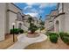View of stucco condo buildings showcasing well-maintained landscaping and inviting walkways, adding curb appeal at 3150 Soft Breezes Dr # 2046, Las Vegas, NV 89128