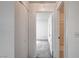 Hallway leading to a carpeted bedroom and a bathroom with tile flooring at 3150 Soft Breezes Dr # 2046, Las Vegas, NV 89128