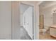 Hallway view leading to a bathroom with a toilet and shower visible at 3150 Soft Breezes Dr # 2046, Las Vegas, NV 89128